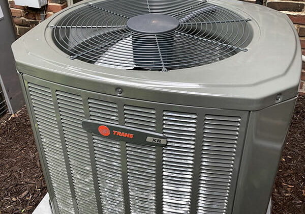New Trane HVAC unit connected to brick home